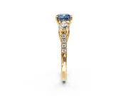 3 Stone Engagement Ring Setting for Fancy Blue Cushion Cut Center with Crossover Basket, Pave Band and Prong Head in Yellow Gold