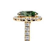 Halo Engagement Ring Setting for Fancy Green Oval Center with Narrowing Pave Band and Prong Head in Yellow Gold