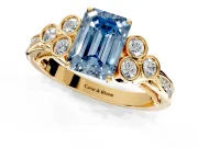 Cluster Engagement Ring Setting for Fancy Blue Emerald Cut Center with Bezel Accent Clusters and Prong Head in Yellow Gold