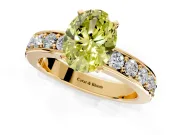 Solitaire Engagement Ring Setting for Fancy Yellow Oval Center with Channel-Set Accents and Prong Head in Yellow Gold