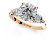 3 Stone Engagement Ring Setting for Round Cut Center with Large Pear-Shaped Accents and Prong Head in Rose Gold