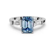 3 Stone Engagement Ring Setting for Fancy Blue Emerald Cut Center with Channel Baguette Accents and Prong Head in Platinum