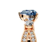 3 Stone Engagement Ring Setting for Fancy Blue Heart-Shaped Center with Pave Twist Band and Prong Head in Rose Gold