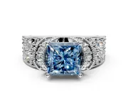 Pave Engagement Ring Setting for Fancy Blue Princess Cut Center with Curved Accent Rows, Openwork and Prong Head in White Gold