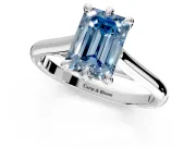 Solitaire Engagement Ring Setting for Fancy Blue Emerald Cut Center with Cathedral Band and Prong Head in White Gold