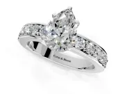 Solitaire Engagement Ring Setting for Pear-Shaped Center with Channel-Set Accents and Prong Head in Platinum