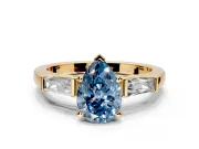 3 Stone Engagement Ring Setting for Fancy Blue Pear-Shaped Center with Tapered Baguettes, Plain Band and Prong Head in Yellow Gold