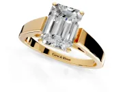 Solitaire Engagement Ring Setting for Emerald Cut Center with Tapered Split Shoulders and Prong Head in Yellow Gold