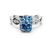 Solitaire Engagement Ring Setting for Fancy Blue Radiant Cut Center with Accented Twist Band and Leaf Prong Head in Platinum