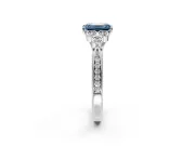 Cluster Engagement Ring Setting for Fancy Blue Emerald Cut Center with Bezel Accent Clusters and Prong Head in Sterling Silver