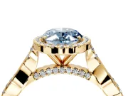 Halo Engagement Ring Setting for Fancy Blue Oval Center with Twist Band and Prong Head in Yellow Gold