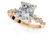 Solitaire Engagement Ring Setting for Radiant Cut Center with Trailing Leaf Accent Band and Prong Head in Rose Gold