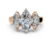 3 Stone Engagement Ring Setting for Marquise Center with Raised Basket Heads and Prong Head in Rose Gold