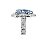 Halo Engagement Ring Setting for Fancy Blue Pear-Shaped Center with Narrowing Pave Band and Prong Head in White Gold