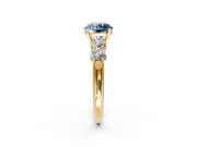 5 Stone Engagement Ring Setting for Fancy Blue Round Cut Center with Graduated Accents and Prong Head in Yellow Gold