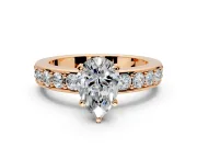Solitaire Engagement Ring Setting for Pear-Shaped Center with Channel-Set Accents and Prong Head in Rose Gold