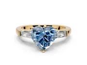 3 Stone Engagement Ring Setting for Fancy Blue Heart-Shaped Center with Tapered Baguettes, Plain Band and Prong Head in Yellow Gold