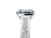Solitaire Engagement Ring Setting for Emerald Cut Center with Princess Cut Channel Band and Prong Head in Platinum