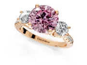 3 Stone Engagement Ring Setting for Fancy Pink Round Cut Center with Crossover Basket, Pave Band and Prong Head in Rose Gold