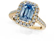 Halo Engagement Ring Setting for Fancy Blue Emerald Cut Center with Narrowing Pave Band and Prong Head in Yellow Gold