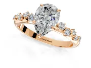 Cluster Engagement Ring Setting for Pear-Shaped Center with Round Cut Accent Band and Prong Head in Rose Gold
