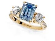 3 Stone Engagement Ring Setting for Fancy Blue Emerald Cut Center with Crossover Basket, Pave Band and Prong Head in Yellow Gold