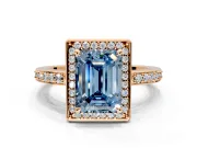 Halo Engagement Ring Setting for Fancy Blue Emerald Cut Center with Metal-Rimmed Halo, Pave Band and Prong Head in Rose Gold