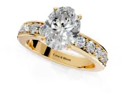 Solitaire Engagement Ring Setting for Oval Center with Channel-Set Accents and Prong Head in Yellow Gold