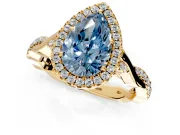 Halo Engagement Ring Setting for Fancy Blue Pear-Shaped Center with Twist Band and Prong Head in Yellow Gold