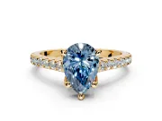 Solitaire Engagement Ring Setting for Fancy Blue Pear-Shaped Center with Widening Pave Band and Claw Prong Head in Yellow Gold