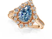 Milgrain Halo Engagement Ring Setting for Fancy Blue Pear-Shaped Center with Bezel Point Accents and Prong Head in Rose Gold