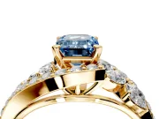 Halo Engagement Ring Setting for Fancy Blue Emerald Cut Center with Marquise and Pave Bypass Band and Prong Head in Yellow Gold