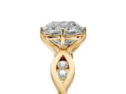 Solitaire Engagement Ring Setting for Cushion Cut Center with Accented Twist Band and Leaf Prong Head in Yellow Gold
