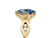 Solitaire Engagement Ring Setting for Fancy Blue Oval Center with Accented Twist Band and Leaf Prong Head in Yellow Gold