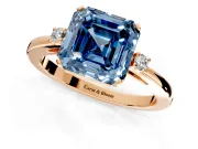 3 Stone Engagement Ring Setting for Fancy Blue Asscher Cut Center with Low-Set Round Cut Accents and Prong Head in Rose Gold