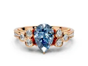 Cluster Engagement Ring Setting for Fancy Blue Pear-Shaped Center with Bezel Accent Clusters and Prong Head in Rose Gold
