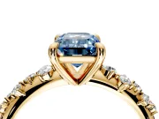 Solitaire Engagement Ring Setting for Fancy Blue Emerald Cut Center with Trailing Leaf Accent Band and Prong Head in Yellow Gold