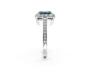 Floral Halo Engagement Ring Setting for Fancy Blue Emerald Cut Center with Large Halo Accents and Prong Head in Platinum