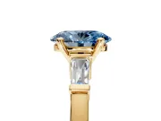 3 Stone Engagement Ring Setting for Fancy Blue Oval Center with Channel Baguette Accents and Prong Head in Yellow Gold