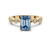 Solitaire Engagement Ring Setting for Fancy Blue Emerald Cut Center with Milgrain Bezel Accents and Prong Head in Yellow Gold