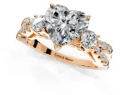 3 Stone Engagement Ring Setting for Heart-Shaped Center with Pave Split Shank and Prong Head in Rose Gold
