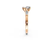 3 Stone Engagement Ring Setting for Heart-Shaped Center with Channel Baguette Accents and Prong Head in Rose Gold