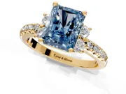Paired Accent Engagement Ring Setting for Fancy Blue Radiant Cut Center with Pave Band and Prong Head in Yellow Gold