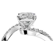 Solitaire Engagement Ring Setting for Cushion Cut Center with Pave Bypass Swirl Band and Prong Head in Platinum