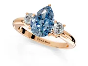 3 Stone Engagement Ring Setting for Fancy Blue Pear-Shaped Center with Wide Plain Band and Prong Head in Rose Gold