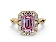 Halo Engagement Ring Setting for Fancy Pink Emerald Cut Center with Twist Band and Prong Head in Yellow Gold