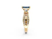 3 Stone Engagement Ring Setting for Fancy Blue Emerald Cut Center with Pave Twist Band and Prong Head in Yellow Gold