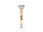 3 Stone Engagement Ring Setting for Fancy Blue Radiant Cut Center with Channel Baguette Accents and Prong Head in Rose Gold