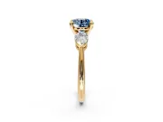 3 Stone Engagement Ring Setting for Fancy Blue Round Cut Center with Large Pear-Shaped Accents and Prong Head in Yellow Gold