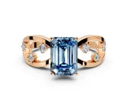 Solitaire Engagement Ring Setting for Fancy Blue Emerald Cut Center with Criss-Cross Accent Band and Prong Head in Rose Gold